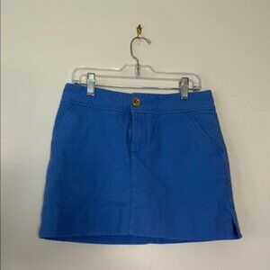 Lilly Pulitzer blue lined skirt with wave design and gold button